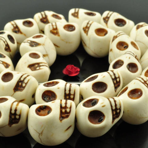 23 pcs of synthetic Turquoise skull shape beads in 13x18mm,White