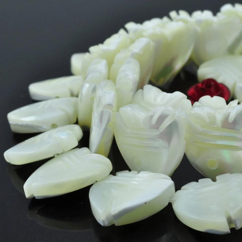 33 pcs of MOP carved Fish Shaped beads in 12X12mm