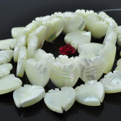 33 pcs of MOP carved Fish Shaped beads in 12X12mm