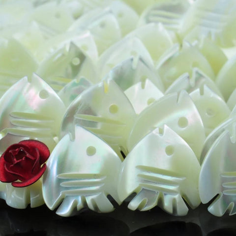 33 pcs of MOP carved Fish Shaped beads in 12X12mm