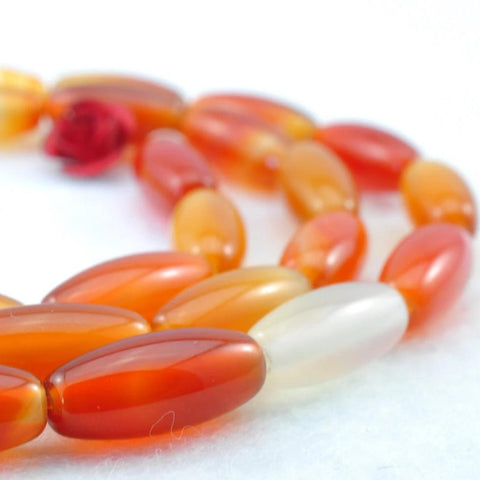 31 pcs of Rainbow Agate smooth drum beads in 5x12mm