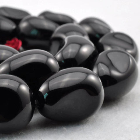 22 pcs of Black Onyx smooth teardrop beads in 13x18mm