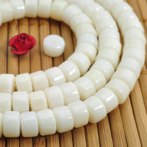 96 pcs of Coral smooth wheel beads in 4x6mm