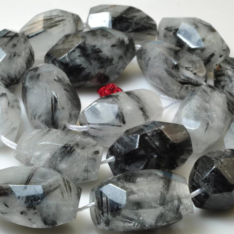 A grade 15 inches of Natural Black Rutilated Quartz faceted nugget beads in 13-15 width X 20-25mm length