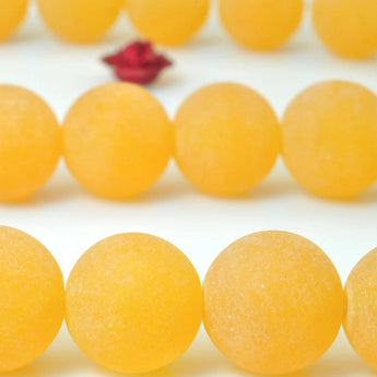 37 pcs of Orange Jade matte round beads in 10mm