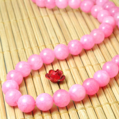 62 pcs of Dyed Pink Jade smooth round beads in 6mm