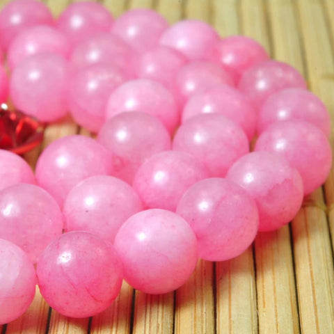 62 pcs of Dyed Pink Jade smooth round beads in 6mm