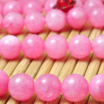 62 pcs of Dyed Pink Jade smooth round beads in 6mm
