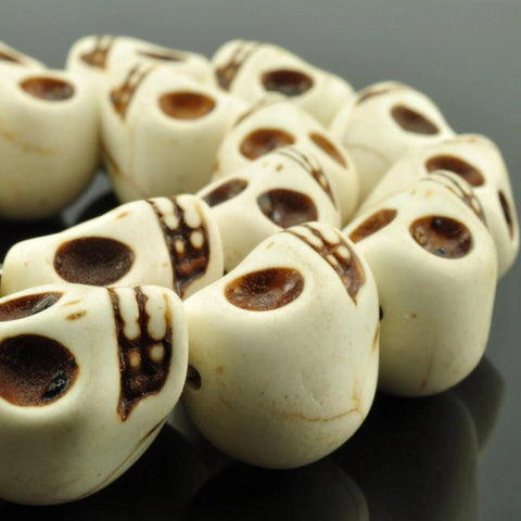 23 pcs of synthetic Turquoise skull shape beads in 13x18mm,White
