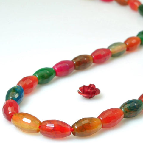 39 pcs of Rainbow Agate faceted  rice beads in 6mm width X 9mm length