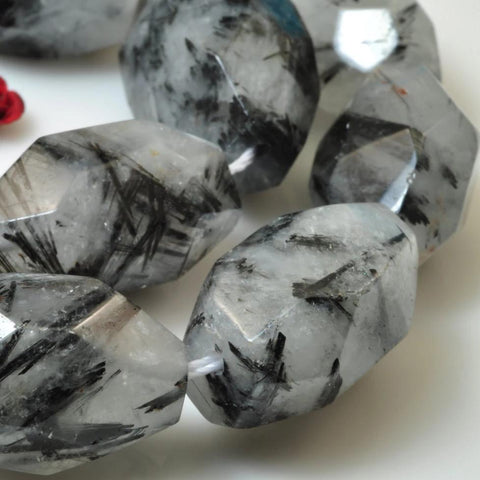 A grade 15 inches of Natural Black Rutilated Quartz faceted nugget beads in 13-15 width X 20-25mm length